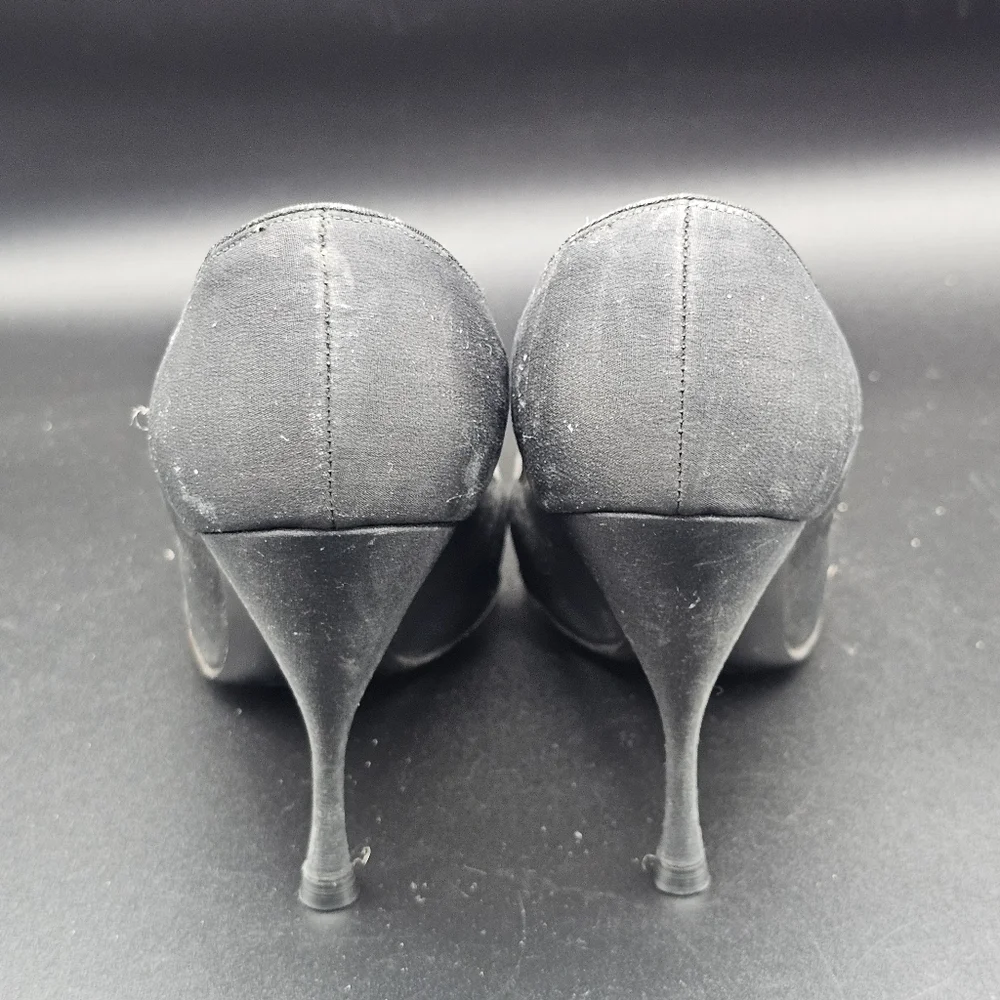 Jacques Heim pumps with a rhinestone-embellished toe.